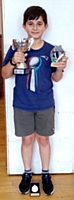 Ben with his cricket trophies